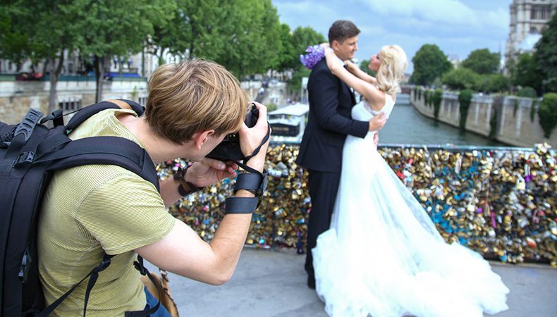 Image Showing A Professional Wedding Photographer Taking Pictures In A Wedding Photo shot