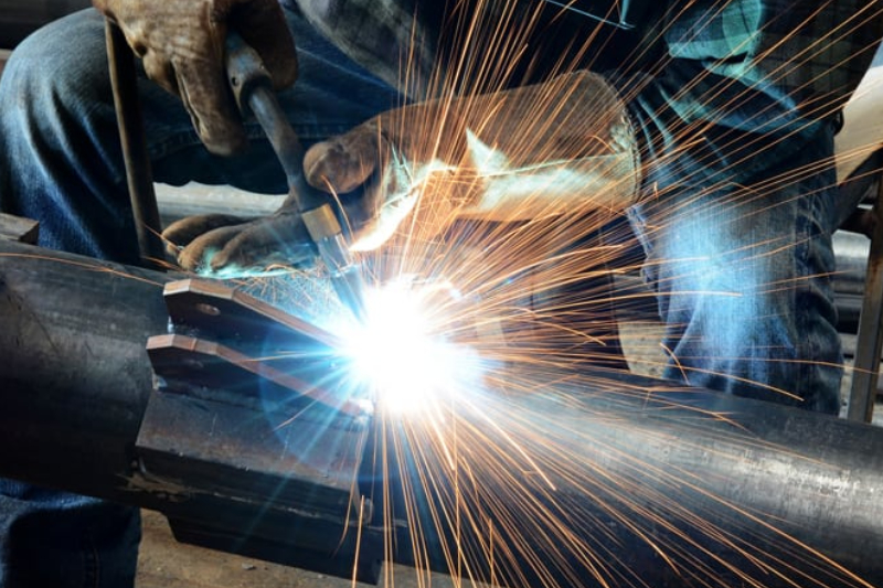 An Image of A Male Welder Working In A Metal Fabrication Company